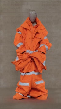 bright orange construction 🦺 style clothing, styled in an extreme oversized fashion and hyper sagged out. Vetement 2023